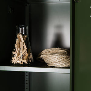 closeup of shelving inside dark olive steel locker
